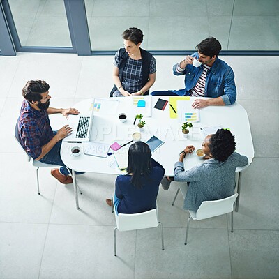 Buy stock photo Office, table and business people in creative workshop for planning, strategy and development from above. Teamwork, men and women in meeting for design ideas with stats, laptop and agency leadership.