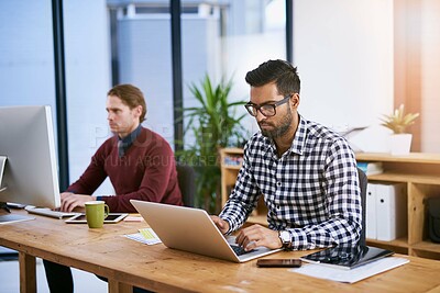 Buy stock photo Laptop, serious and business man typing email for project, report or writing blog in coworking startup. Computer, creative and professional copywriter on article, planning or research info online