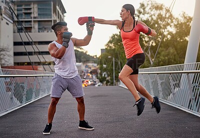 Buy stock photo Bridge, city and kickboxing fitness with couple outdoor together for self defense training. Exercise, hitting or punching with man and woman in urban town for combat sports or physical workout