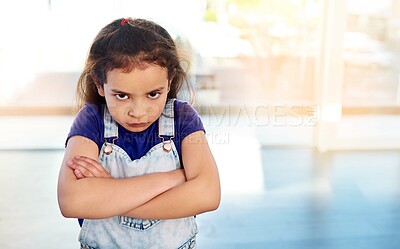 Buy stock photo Female child, portrait and angry in house with arms crossed for frustrated, naughty and decision. Girl, upset and facial expression in home with flare for rebel, tantrum and punishment by parents