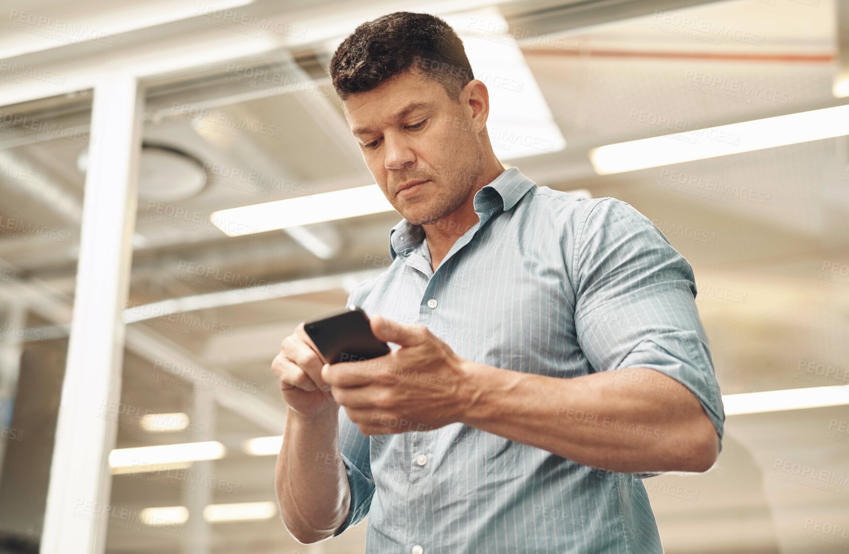 Buy stock photo Man, phone and typing email in office, reading notification and journalist online for column quote. Male person, professional reporter and communication with contact on app, message and web research
