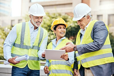 Buy stock photo Shot of a group of businesspeople using a digital tablet while working at a construction site