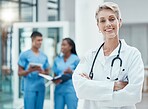 Woman, doctor and smile of a proud medical worker with nurse group feeling success. Healthcare, medicine and happy health worker in a hospital and wellness clinic ready for working and assistance