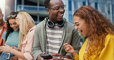 Buy stock photo Friends, students and laughing with phone at university, campus or happy for diversity, learning and development. Gen z people, women and men on mobile app, video and meme on social media at college