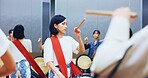 Japanese, learning and woman with drums for music on instrument for performance, practice and class. Taiko, people or female drummers in band to play in group rehearsal for culture, rhythm or beat