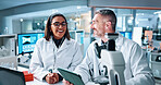 Science, smile and tablet with people in laboratory together for breakthrough or development. Collaboration, laptop and microscope with happy research team in clinical trial for investigation