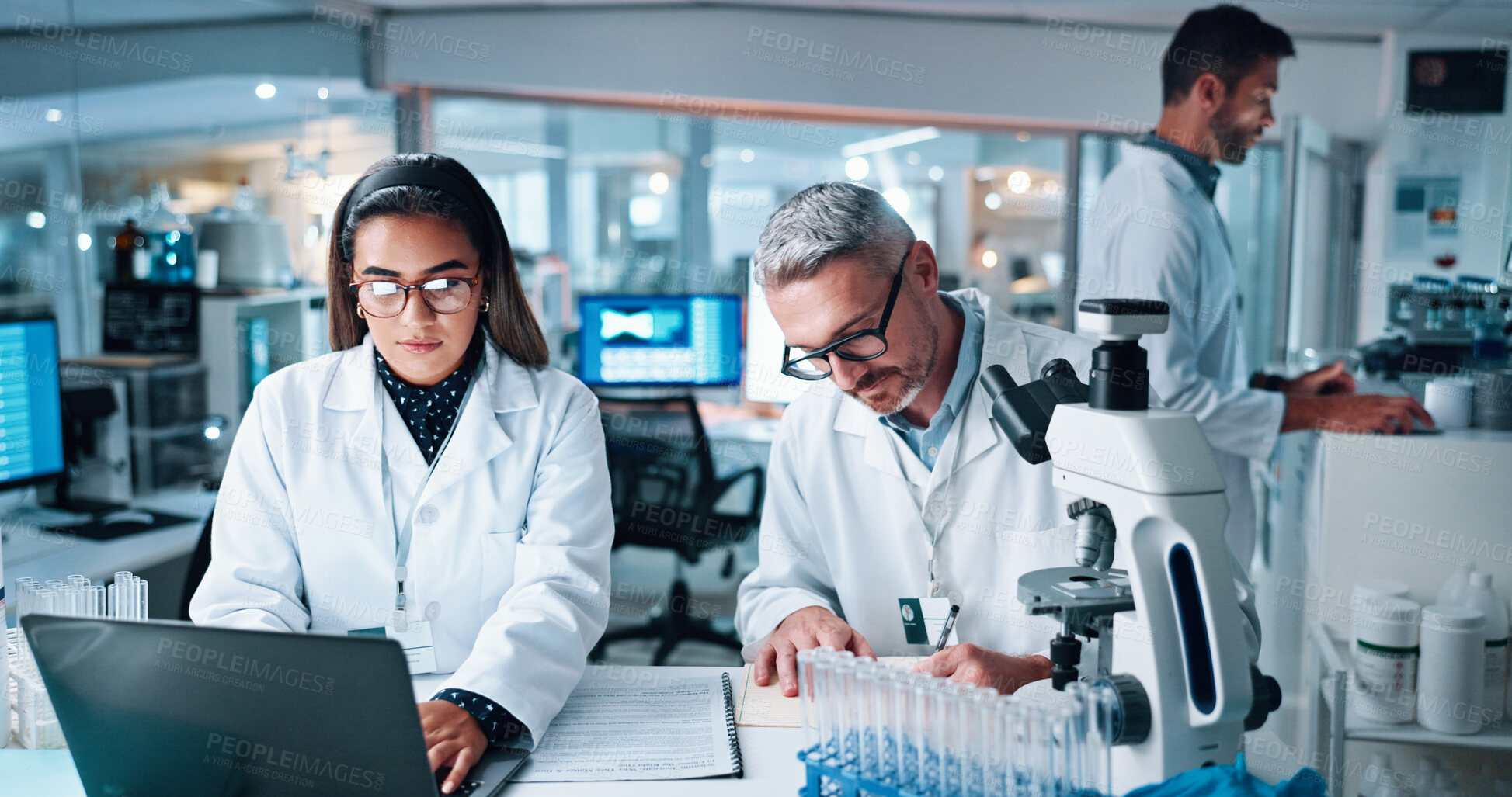 Buy stock photo Collaboration, laptop and science with people in laboratory together for breakthrough or development. DNA, microscope and writing with research team in clinical trial for discovery or medical report