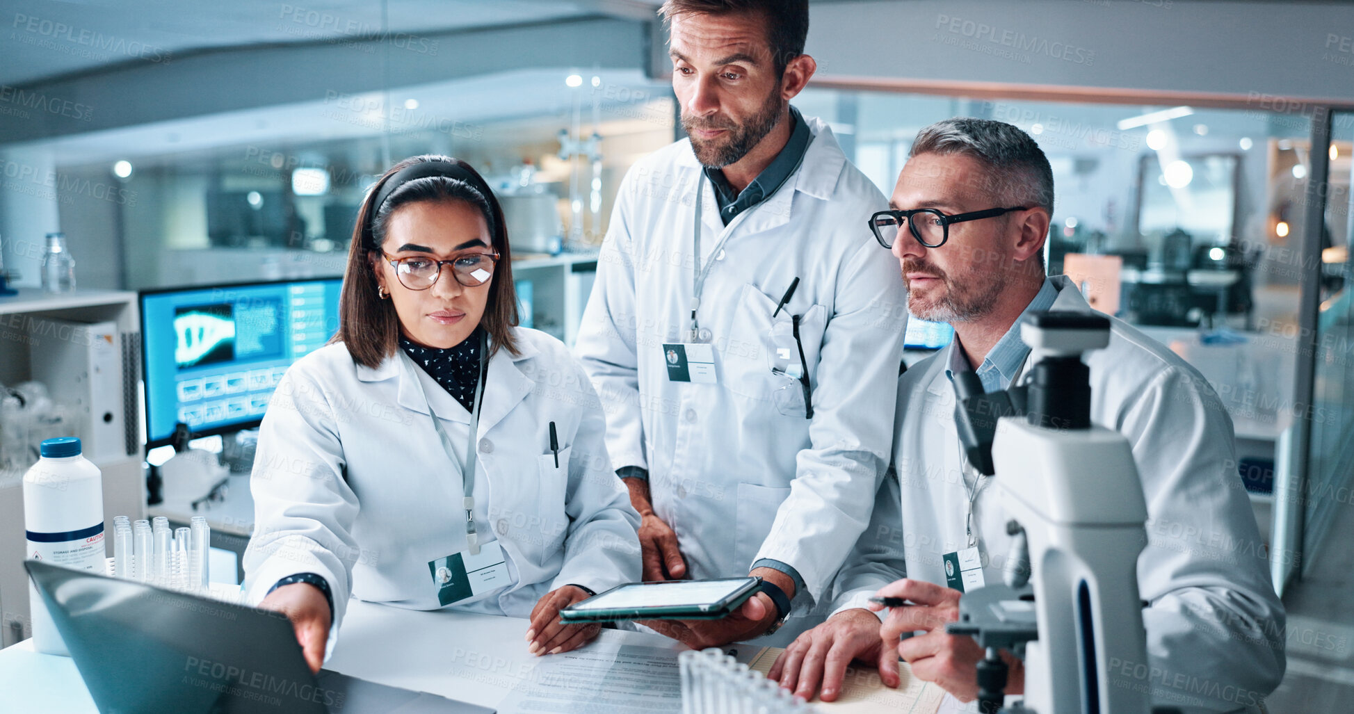 Buy stock photo Laptop, science and tablet with people in laboratory together for breakthrough, development or results. Computer, microscope and pointing with medical research team in clinical trial for discovery
