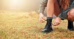 Boots, hiking and woman tying laces outdoor for activity, exploring or adventure on holiday. Fitness, hands and closeup of female person getting ready with shoes for trekking in nature for exercise.