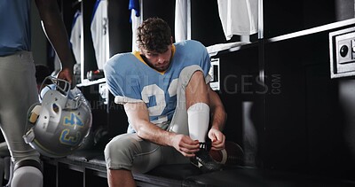 Tie, laces or football player in locker room for sports preparation, match and waiting on game. Athlete, start or getting ready at half time of competition, fitness challenge and tournament event