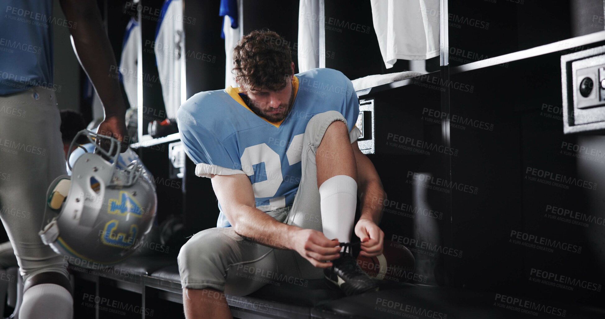 Buy stock photo Tie, laces or football player in locker room for sports preparation, match and waiting on game. Athlete, start or getting ready at half time of competition, fitness challenge and tournament event
