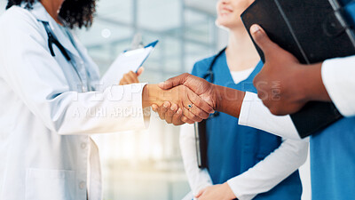 Buy stock photo Doctors, handshake and team at hospital, welcome and clipboard with thanks, meeting and celebration. People, medical staff and shaking hands for success, praise and achievement in career at clinic