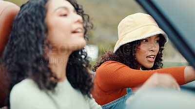 Buy stock photo Talking, road trip or friends in car for holiday, travel or vacation on outdoor adventure. Pointing, explore or women with destination, memory or motor vehicle for weekend getaway, scenery or journey