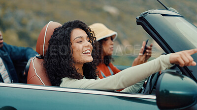 Buy stock photo Pointing, road trip or friends in car for holiday, travel or vacation on outdoor adventure. Happy, explore or women with destination, view or motor vehicle for weekend getaway, scenery or journey