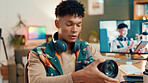 Content creator, live streaming and man with camera for review, feedback and tech vlog in home. Influencer, social media and person talking for recording video, podcast and opinion to audience
