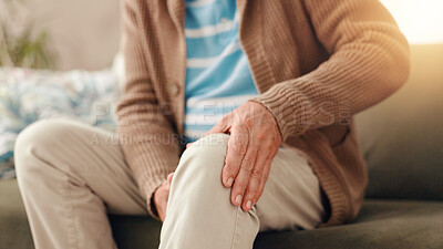 Buy stock photo Senior man, sofa and knee pain with injury for chronic illness, arthritis or fibromyalgia at home. Closeup, elderly or male person with sore leg, accident or medical emergency for joint inflammation