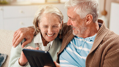 Buy stock photo Senior couple, tablet and happy on sofa in home with hug, laughing and relax with film in living room. Elderly man, woman and digital touchscreen with app for movies, comedy and video in retirement