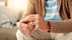 Hands, home and old man with doubt, ring and toxic relationship with divorce, sad and confused. Pensioner, apartment and elderly person with closeup, frustrated and conflict with anxiety and crisis