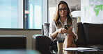Phone, reading and waiting with business woman in office lobby for job opportunity or vacancy. App, resume and text message with candidate on sofa in workplace for hiring, interview or recruitment