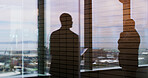 Business people, shadow and window with reflection on balcony for corporate insight or travel. Silhouette, employees or company spectrum with vision for negotiation on economic structure in city