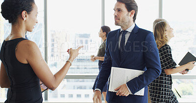Buy stock photo Pointing, office and business people in discussion with report for feedback, review or planning. Professional, corporate and woman with man in meeting with documents for strategy, project or proposal