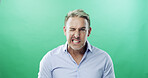 Wink, portrait and businessman in studio with joke, eye signal or secret favour. Green background, funny face and silly manager in human resources with comedy, onboarding corruption and mockup space