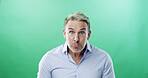 Shock, portrait and businessman in studio with bad news, announcement and frown. Face expression, unhappy and mature professional with problem, surprised and serious with mockup on green background