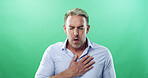 Chest pain, sick and man in studio, coughing and tuberculosis on green background. Person, illness and model with stress, breathing and asthma with heartburn, allergy and emergency with heart attack