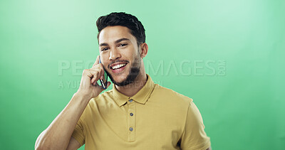 Buy stock photo Man, phone call and happy in studio portrait with talk, listen and connection by green background. Person, smartphone and conversation with mobile network, smile or chat with mockup space in Colombia