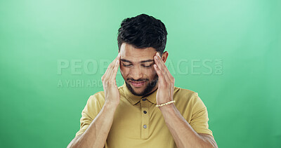 Buy stock photo Headache, stress and man in studio with burnout, fatigue or exhaustion for medical sickness. Tired, illness and male person with migraine for flu, cold or allergy symptom by green background.