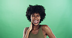 Portrait, funny face and black woman in studio, smile and confident personality on green background. African person, pride and happy model with goofy emoji, crazy and tongue out with humor and silly