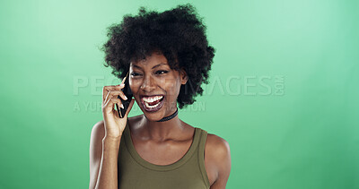 Buy stock photo Talking, phone call and black woman in studio, smile and conversation with contact. African person, discussion and happy model with cellphone, funny or laughing with digital app on green background