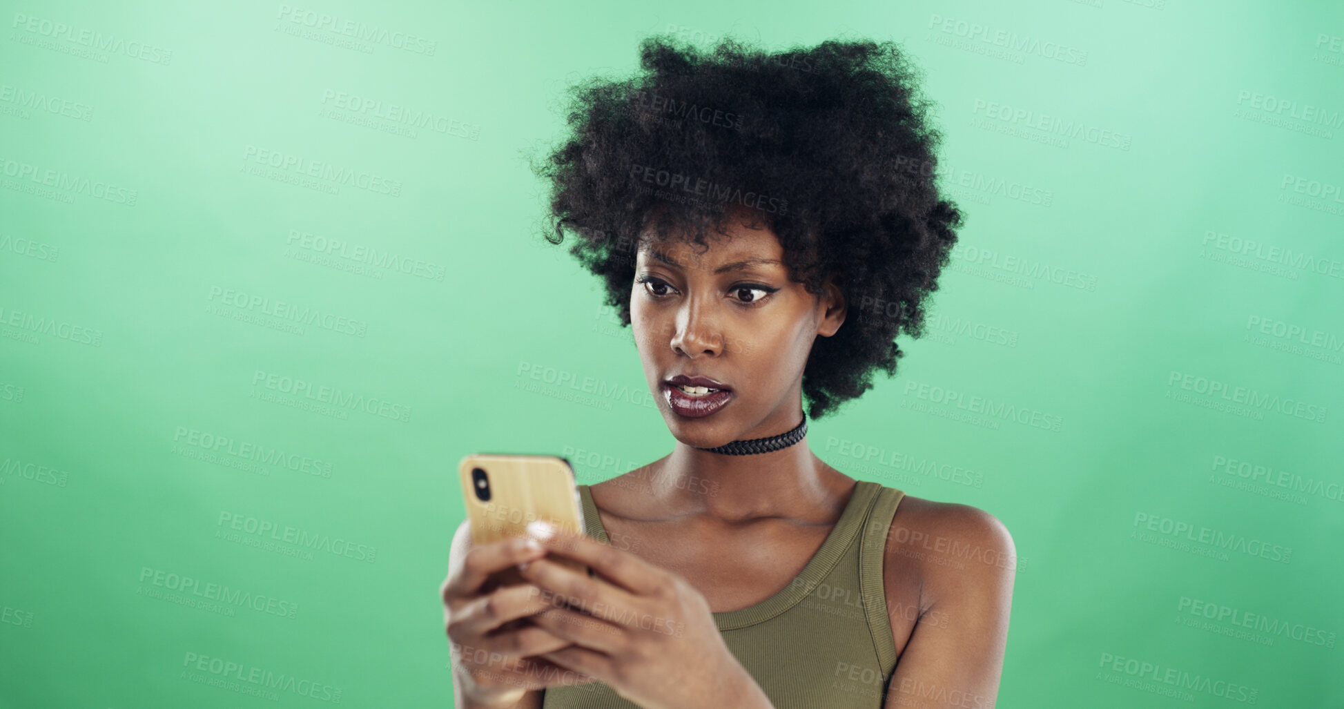Buy stock photo Phone, shock and text message with black woman in studio for communication of bad news or update. App, serious and social media with African person on green background for mobile notification