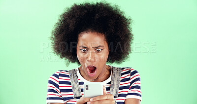 Buy stock photo Black woman, smartphone and shock with open mouth in studio, what or fake news with alert for online message. Surprise announcement, alarm or wow expression with WTF on mobile app on green background