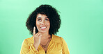Thinking, pointing and woman in studio with choice, decision or ideas for education career. Happy, mockup space and female teacher with planning for lesson with problem solving by green background.