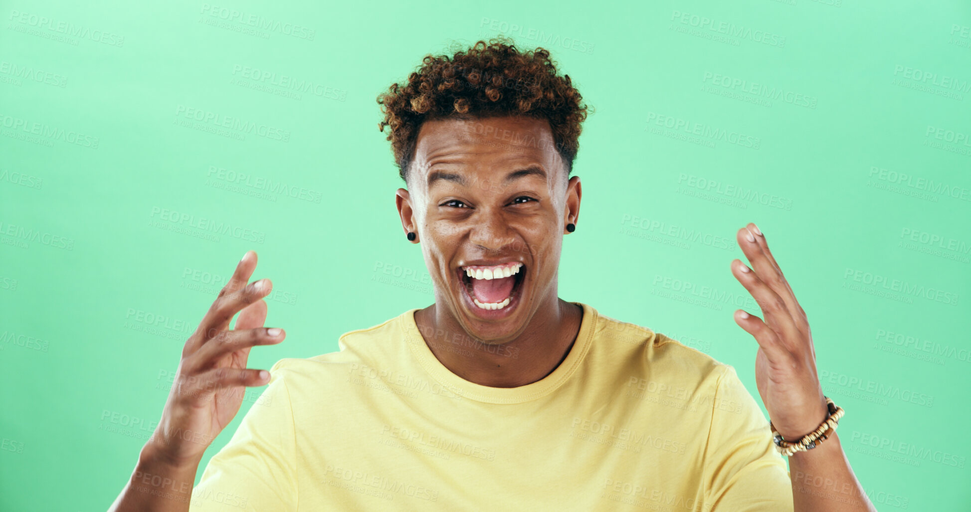 Buy stock photo Excited, comic or laugh with black man on green background in studio for humor, joke and meme. Portrait, smile and comedy with happy African student, model and reaction with positive gesture and joy