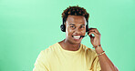 Black man, headset and smile in studio for call center, advice and mockup space with talk by green background. Person, agent and sales consultant with voip mic, portrait and telemarketing in Kenya