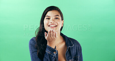 Buy stock photo Portrait, woman and blow kiss in studio for flirting, show attraction and romantic gesture. Mockup space, female person and smile for love emoji on valentines day, affection sign and green background