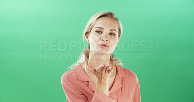 Buy stock photo Portrait, woman and blowing kiss for flirting, show attraction and romantic in studio. Mockup space, female person and gesture with love emoji on valentines day, affection symbol and green background