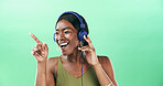 Music, dancer and headphones with black woman in studio for streaming, audio playlist and song. Performance, sound and dancing with female person on green background for entertainment and space