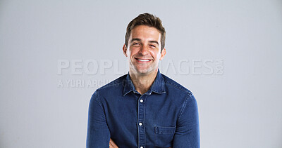 Buy stock photo Portrait, fashion and man in studio, smile and pride with confident personality on gray background space. Face, happy person and model with casual outfit, positive mindset and fun attitude with style