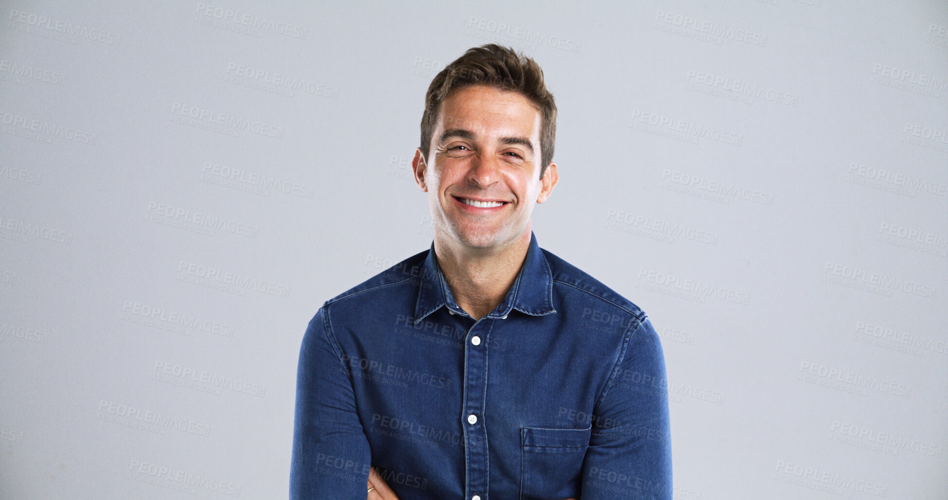 Buy stock photo Portrait, fashion and man in studio, smile and pride with confident personality on gray background space. Face, happy person and model with casual outfit, positive mindset and fun attitude with style