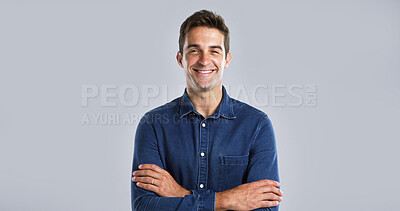 Buy stock photo Confident, fashion and man with arms crossed, studio and happy with streetwear and white background. Mockup space, portrait and person with denim outfit, trendy and stylish with clothes in Canada