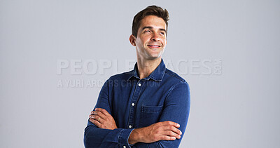 Buy stock photo Arms crossed, thinking and vision with man in studio for daydreaming or memories on mockup space. Future, ideas and smile with thoughtful person on white background for problem solving or solution