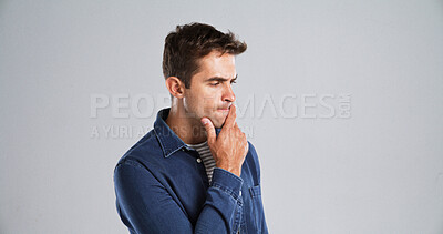 Buy stock photo Thinking, man and confused with doubt in studio for fake news, problem solving or brainstorming. Mockup space, puzzled and person contemplating with planning, solution and serious on gray background