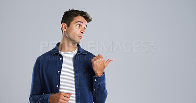 Buy stock photo Pointing, offer and man in studio, promotion and announcement on gray background. Person, mockup space and model with hand gesture, opportunity and discount deal with sales, decision and choice