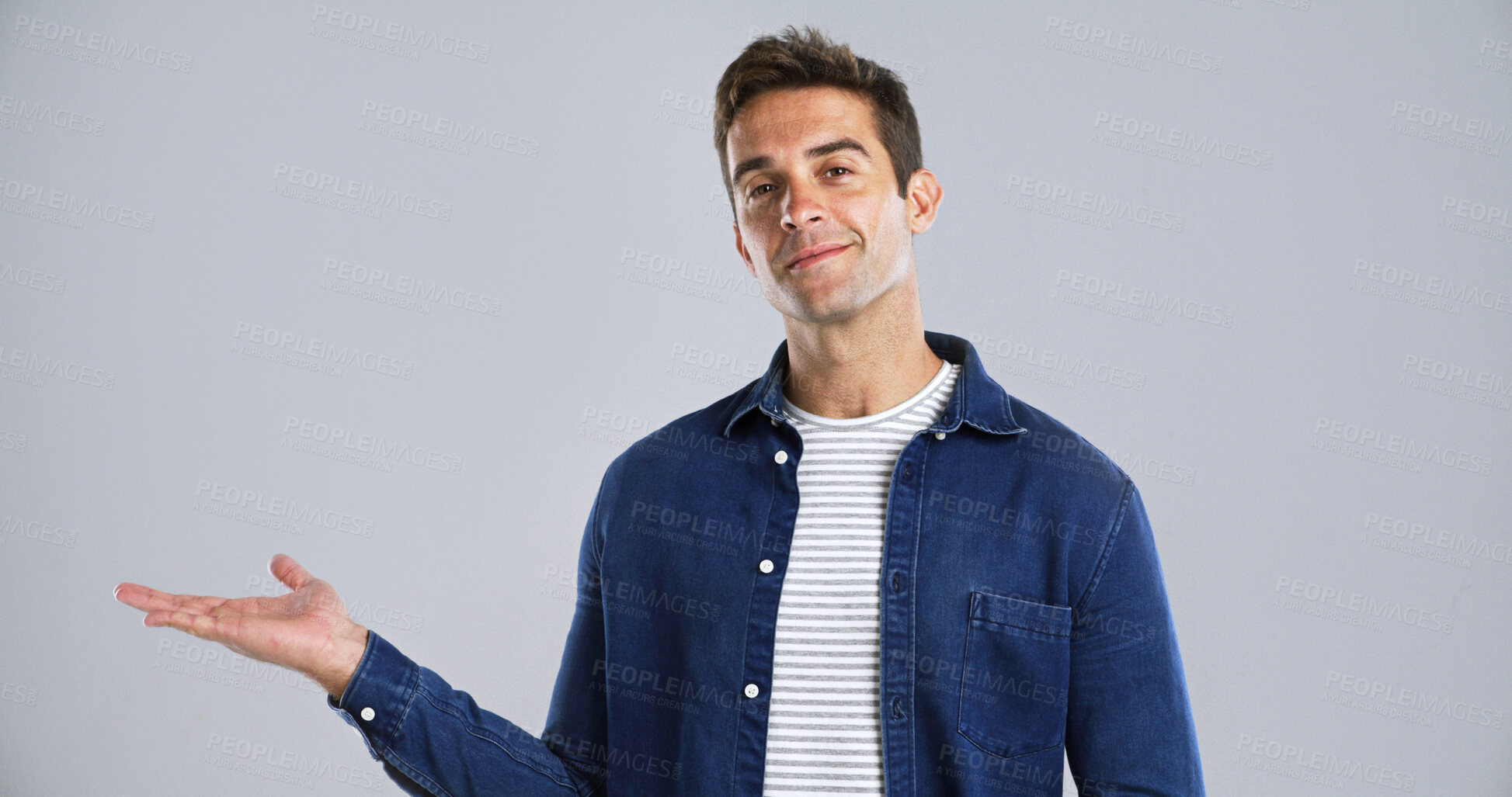 Buy stock photo Man, portrait and hand out with advertising in studio for marketing on white background. Male person, model or smile with palm or deal for notification, alert or fashion promotion on mockup space