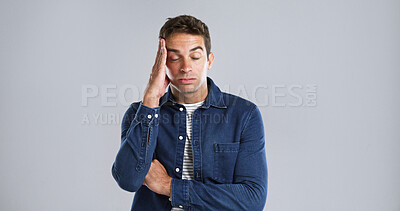 Buy stock photo Tired, headache and man in studio, stress and burnout with tension on white background. Fatigue, person and model with migraine, anxiety and mental health with pressure, mockup space and pain
