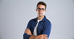 Portrait, fashion and man with arms crossed, studio and confident with streetwear and mock up space. White background, proud and person with denim outfit, trendy and stylish with clothes in Canada
