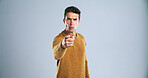 Portrait, pointing to you and man with threat, blame and selection on white studio background. Angry, person and model with hand gesture, fight and mockup space with decision and accountability